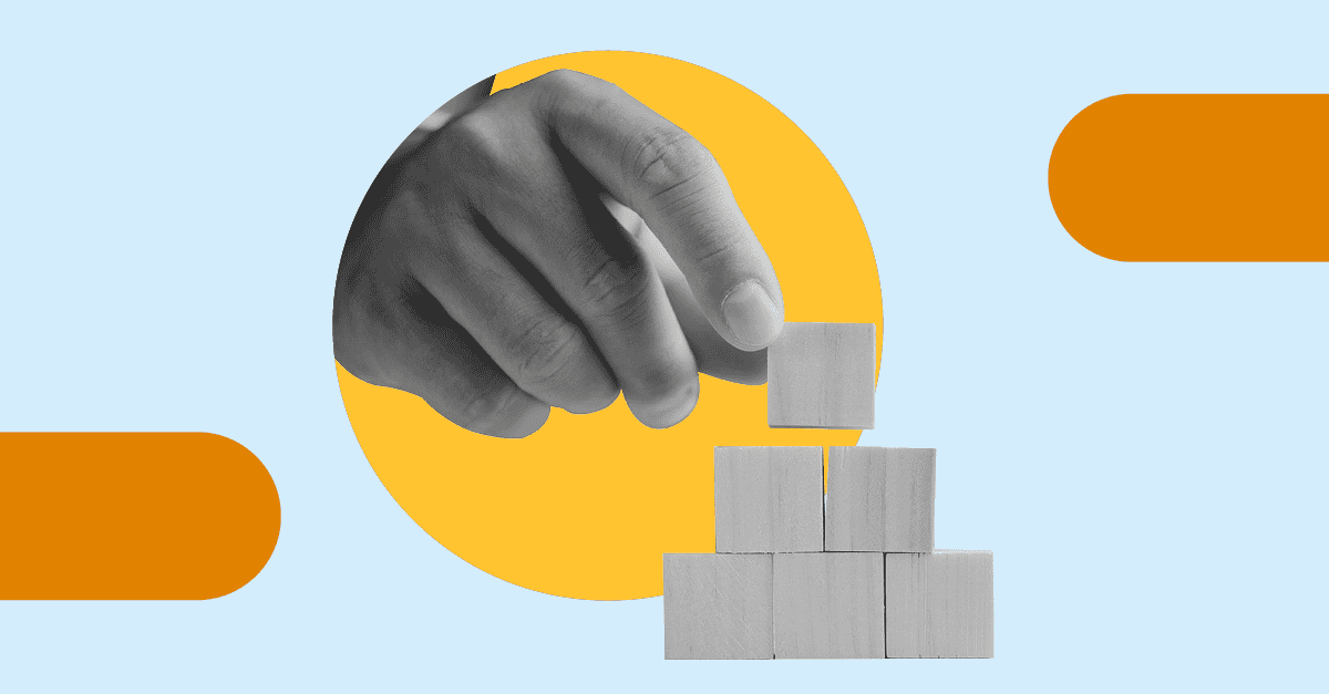 A monochrome photograph of a hand stacking building blocks with graphics in the background, to illustrate the theme of the blog post '6 ways to build your ransomware resilience'. 