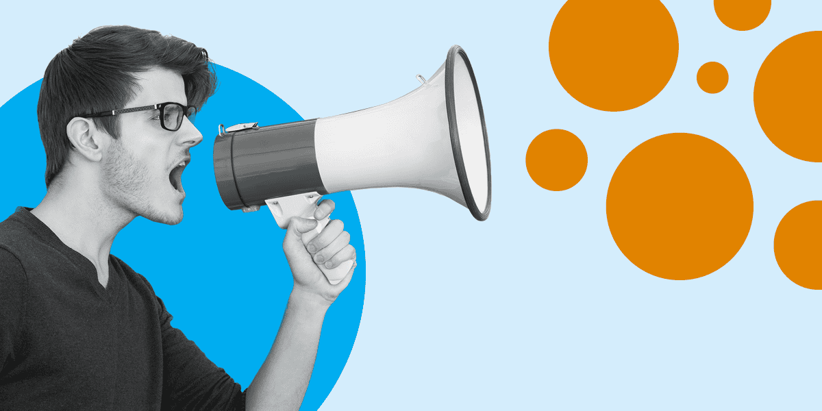 A man shouting through a megaphone to convey a news announcement.